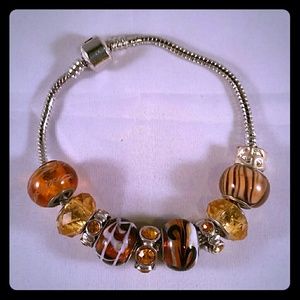 BRAND NEW SILVER AND AMBER GLASS CHARMS BRACELET